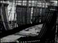 Video clip of "Men Working" (Image: partially constructed ship)