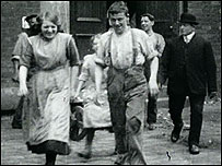 Workers leaving mill