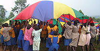 Pupils in Masindi Africa playing parachute games