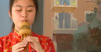 Pupil from Xinghai music school plays Chinese flute