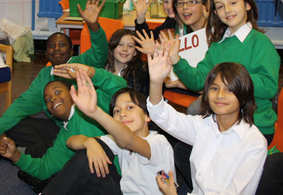 Children in London wave to Tobago